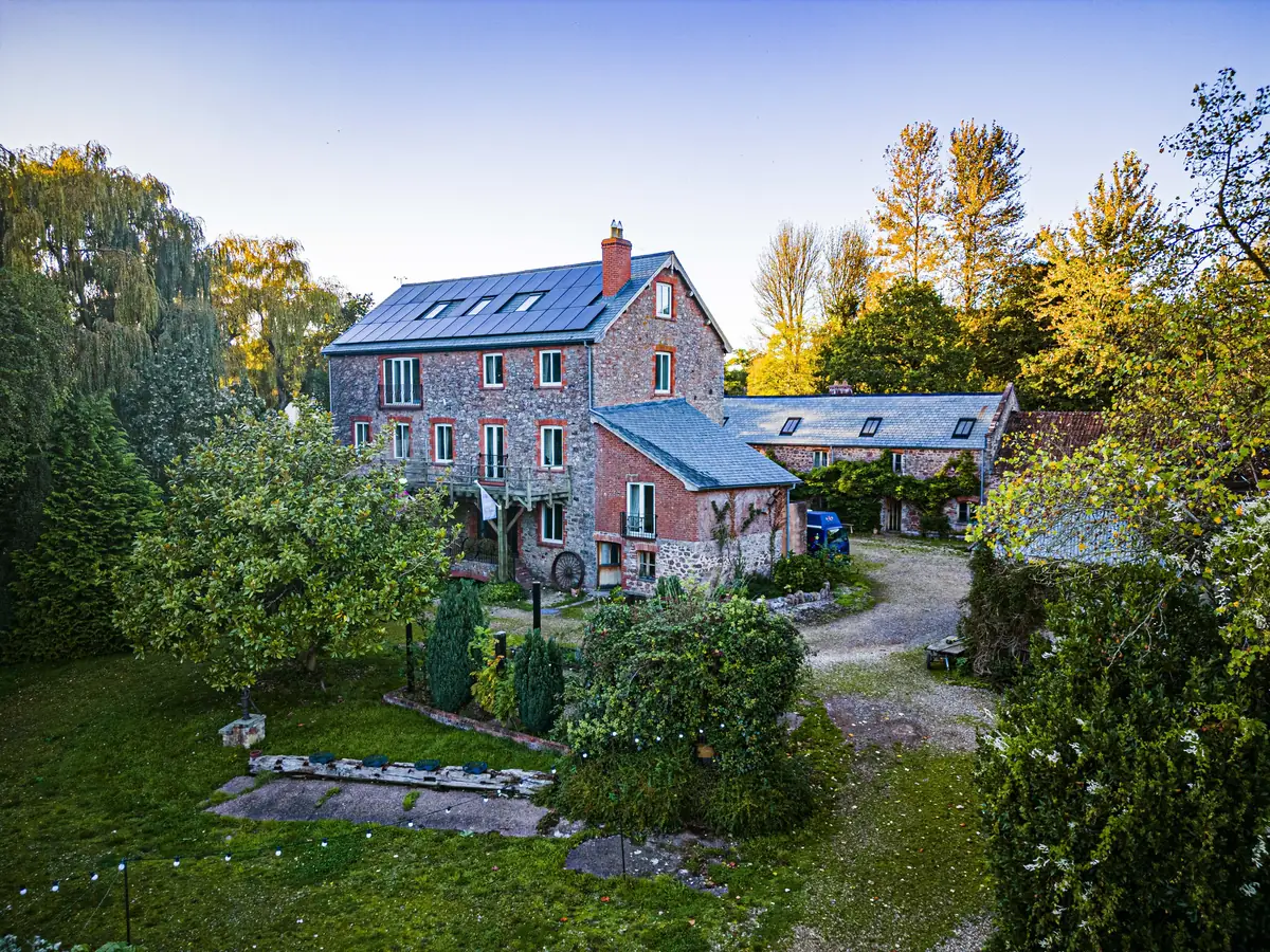 Selgars Mill, a stone mill house and outbuildings among gardens and orchard in Devon